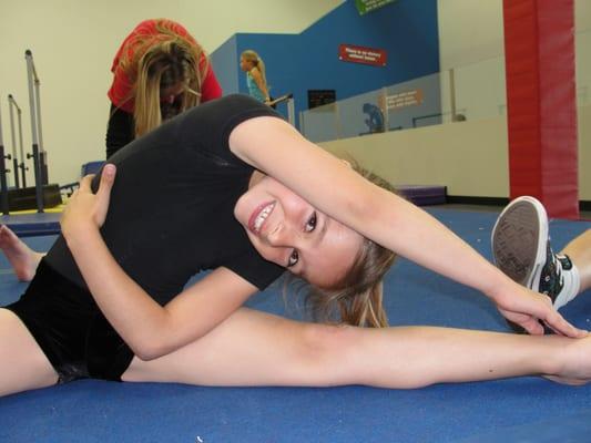 It's important to stretch before gymnastics class!