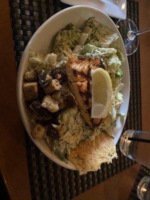 Caesar salad with salmon.