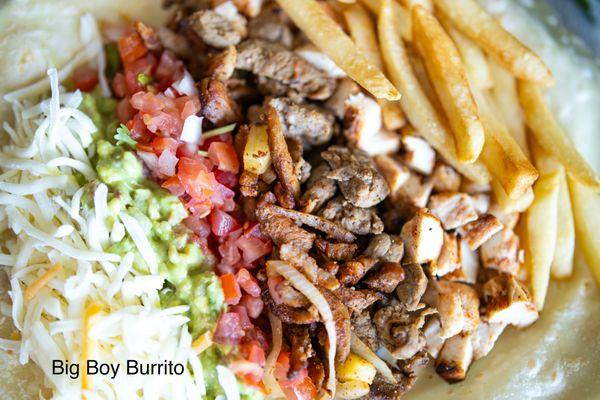 Big Boy Burrito, comes with grilled steak, pastor meat, grilled chicken, pico de gallo, guacamole, french fries, and sour cream.