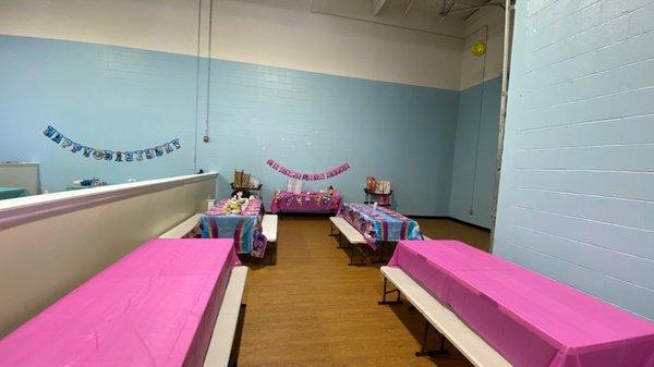 One of the birthday party rooms. Comes with the pink table coverings. Half wall between these two party rooms