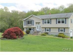 My New home after Adam Quenneville Roofing & Siding installed new siding and windows.