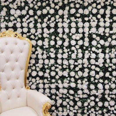 White flower backdrop with gold throne chair