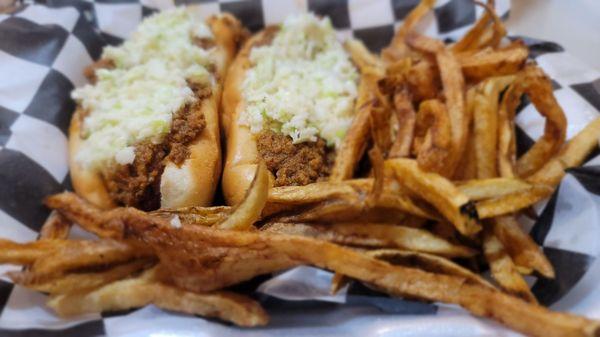 Two Mad Dogs (Deep fried, bacon wrapped hot dogs) topped with chili, cheese, and slaw with a side of fries.