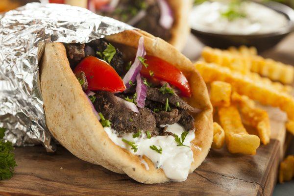 Traditional way of making the great wrap. Beef, Onions, Tomatoes, Tzatziki