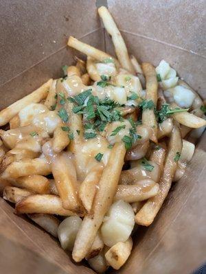 Classic Poutine fries, brown gravy with cheese curds.