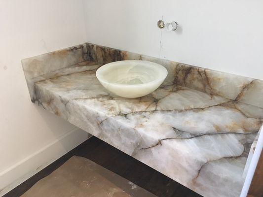 Skyfall Quartzite with a mitered edge and vessel sink