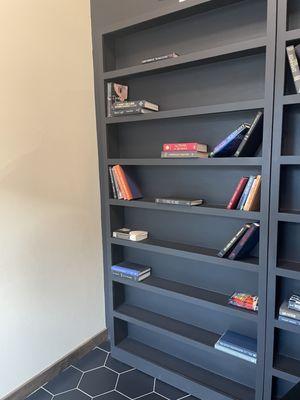 You enter through a bookshelf by giving a password