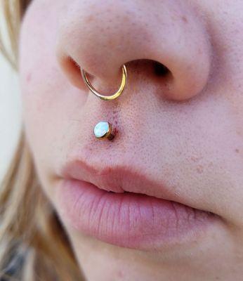 Philtrum piercing by Chandra Jade, anodized rose gold in house.