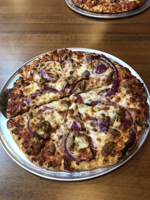 Small pizza with Italian sausage and onion