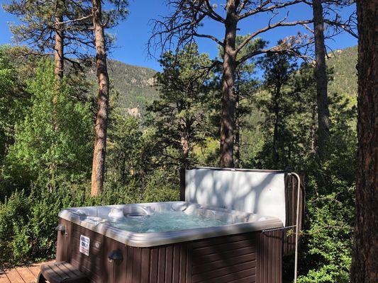 Private outdoor hot tub with beautiful mountain views