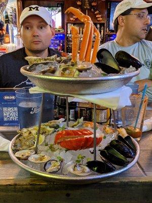 Seafood Tower. Lobster, snow crab legs, house oysters, shrimp, Cedar Key clams, PEI mussels, mignonette and cocktail sauce. $45.