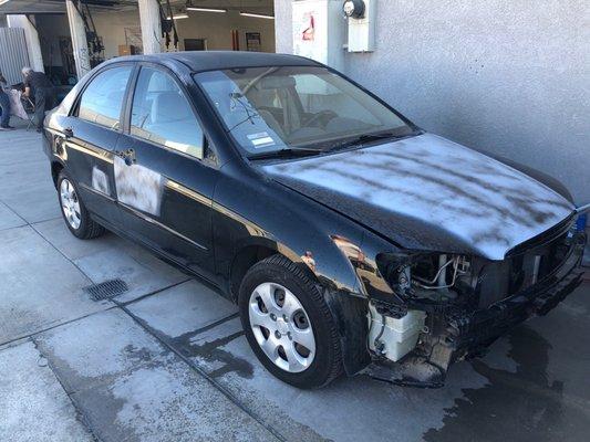 Headlights, taillights, grille and both bumpers removed to ensure even painting