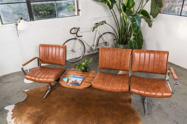 We've updated this original airport bench from PDX with luxurious brown leather and Sapele wood table and armrests.