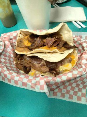 My second favorite taco chorizo beans with cheese and bacon homemade tortillas you can't get that nowhere else.