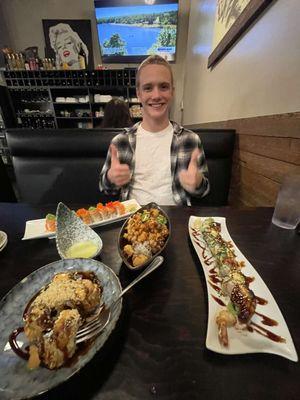 Me and my sushi sakai (bottom left), Godzilla roll (right side), Gonzaga roll (center), and pretty woman roll, top left. SO YUMMY!