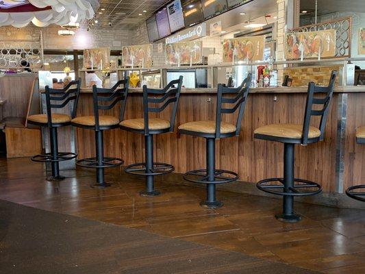 Bar seating  in dining room with purse hooks