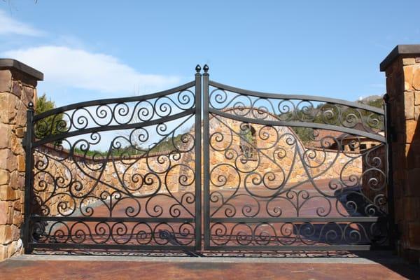 Custom arched Iron double swing gate