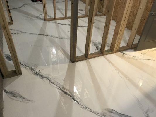 Designer metallic marble epoxy flooring for interior residential high traffic areas.