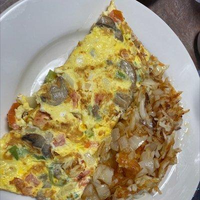 Vegetarian omelette with hash browns with onion