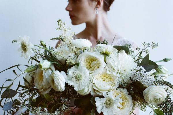 Bridal bouquet by the green dandelion. Photo by James Fitzgerald.