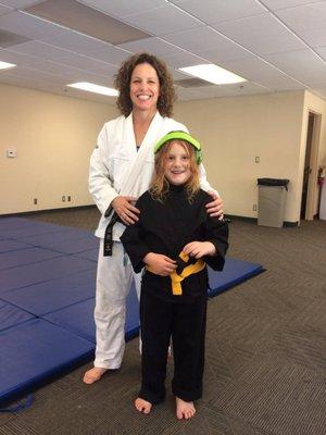 Coach Kristen and a new Yellow belt!