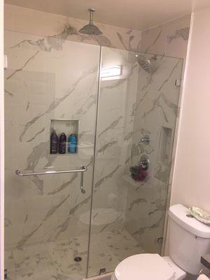 New frameless shower unit with towel bar handle combo on door and clamps on panel