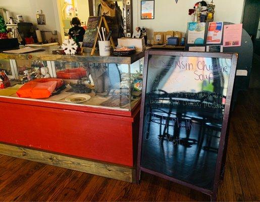 Restaurant ordering counter with daily specials (blackboard) and various decorations