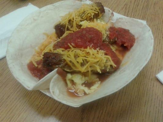 Travis Breakfast Taco: Flour Tortilla, Refried Beans, Egg, Sausage, Cheese & Salsa. Great way to start a New Day!