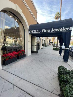 The Front Window Display and Awnings of our store on El Paseo, Ozel Jewelers of Palm Desert.