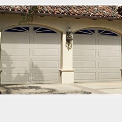 Two single  car garage with SUNBURST  WINDOWS.