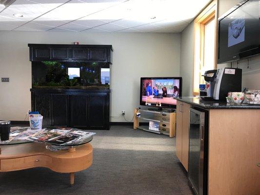 Nice waiting area with TV, magazines, coffee and snacks.