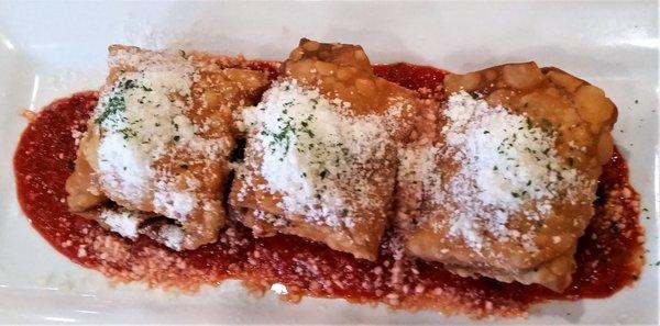 Tascas - meatball wrapped in shell, topped w/ parmigiana, on pomodoro sauce.