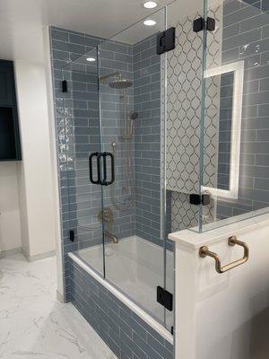 Frameless Corner Shower on a tub with double doors