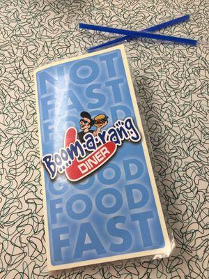 Menu cover and authentic, 50's themed boomerang Formica surfaced tabletop. (Those are drink straws, not chopsticks. )