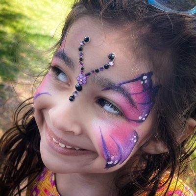 Butterfly face painting with bling