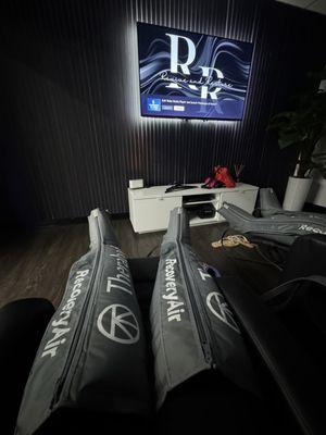 The relaxing recliners in the compression boot room. With access to stream your favorite shows.