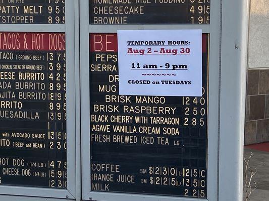 Temporarily closed on TUESDAY's sign at John's on Spring Street in Long Beach, CA. Sign on drive through order's Menu board