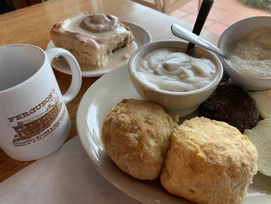 Country breakfast and a cinnamon roll.