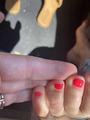 My pedicures toes with excess polish left...