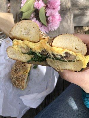 Eggs, cheese, mushroom, and spinach on an everything bagel!