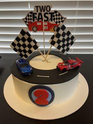 Designed cake. I added the cars myself and the "two fast" decor.