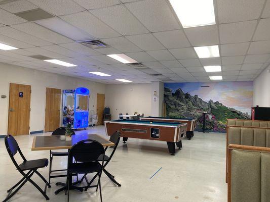 Seating area and pool tables.