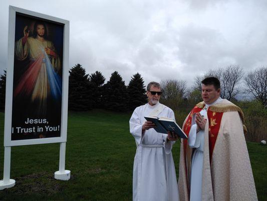 Deacon Bob and Deacon Tim doing a blessing