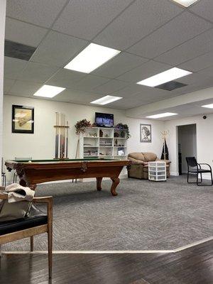 Seating area complete with a billiards table so you could play pool while waiting to get your haircut