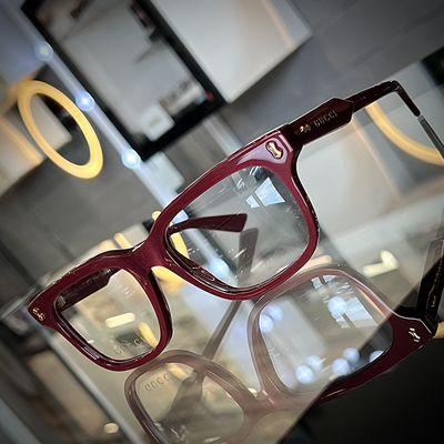 Elevate any look with these sleek unisex burgundy Gucci frames.