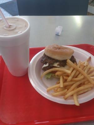 Double cheese burger with the works and fries with chocolate shake.