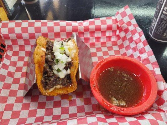 Birria taco with consommé dipping sauce