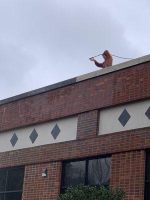 Pressure washing building