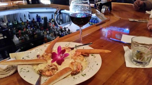 Shrimp fettuccine with a glass of Murieta old vine red. Not just pizza and burgers.