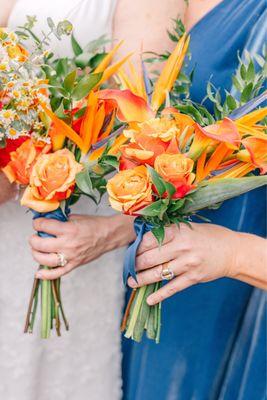 Bridesmaids bouquet of Birds of Paradise and orange roses